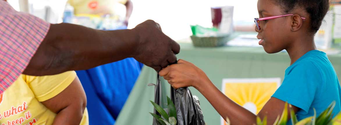 Young Girl buying fruit